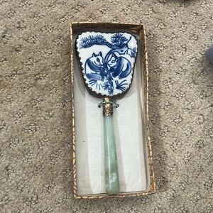 Decorative Chinese hand mirror.